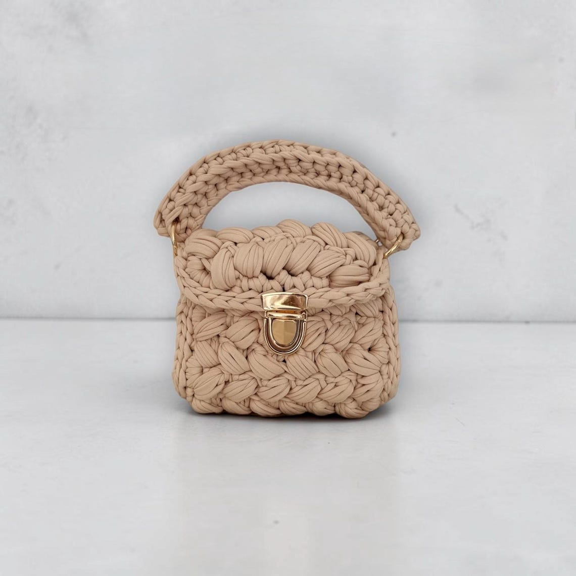 Beige chunky knit crochet mini bag with gold clasp lock