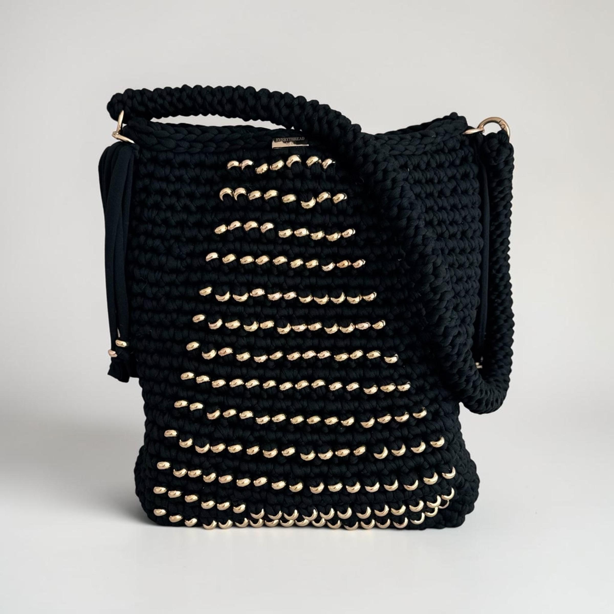 Black crochet shoulder bag with golden beads and tassels