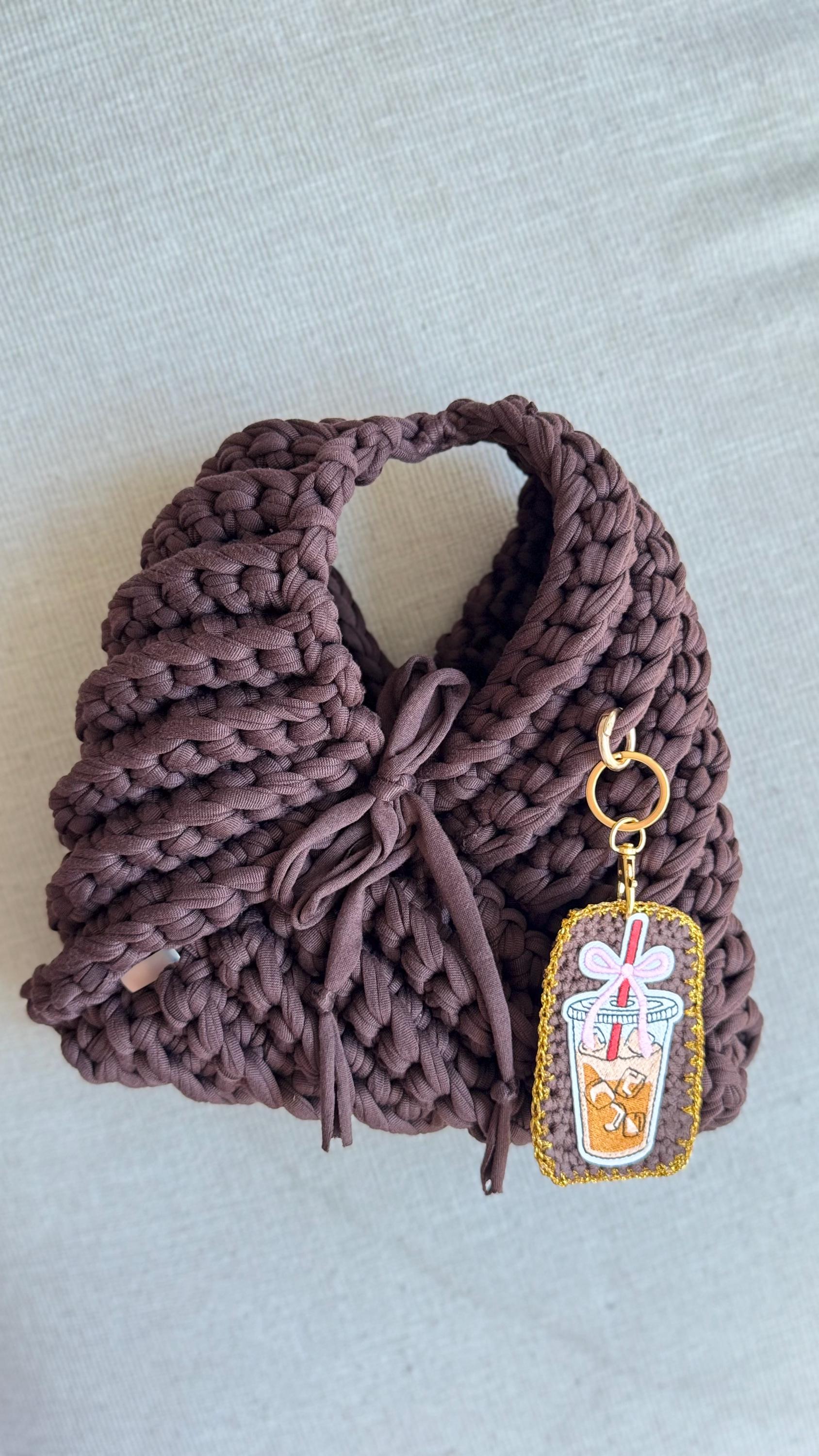 Brown Triangular Handbag with Iced Coffee Charm, detail view