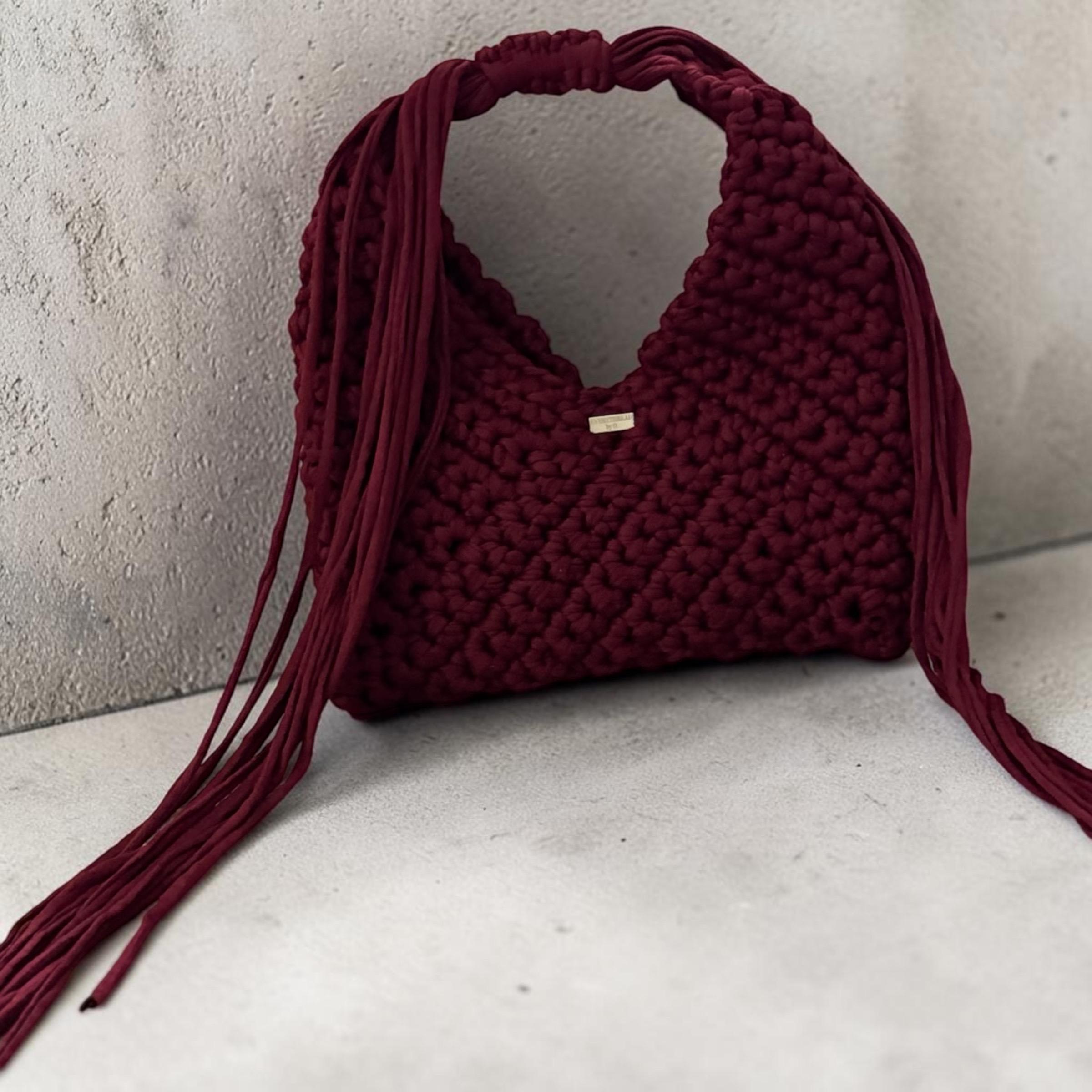 Burgundy Adjustable Triangle Bag, close-up of fringe handle