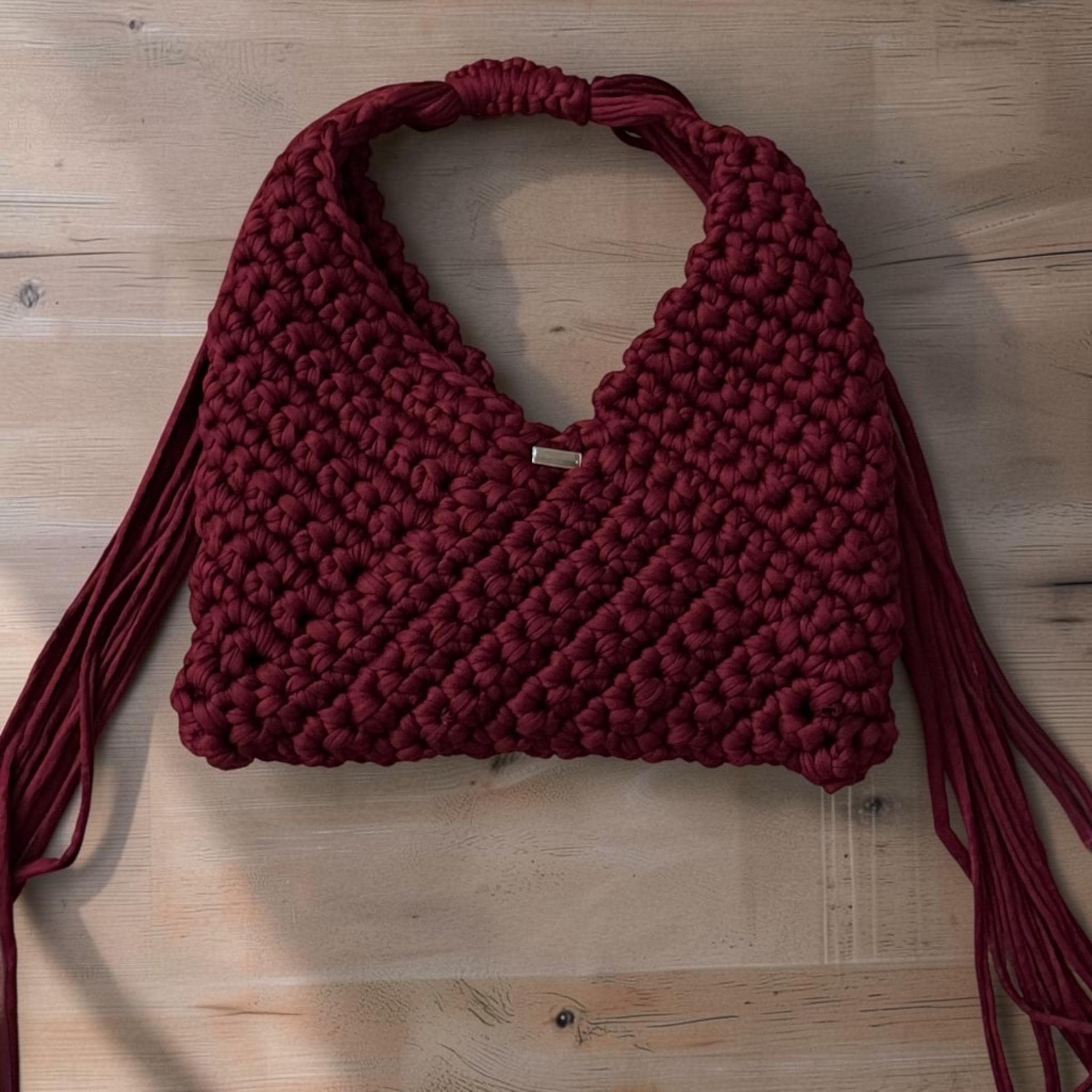 Burgundy crochet triangle bag with adjustable fringe handle
