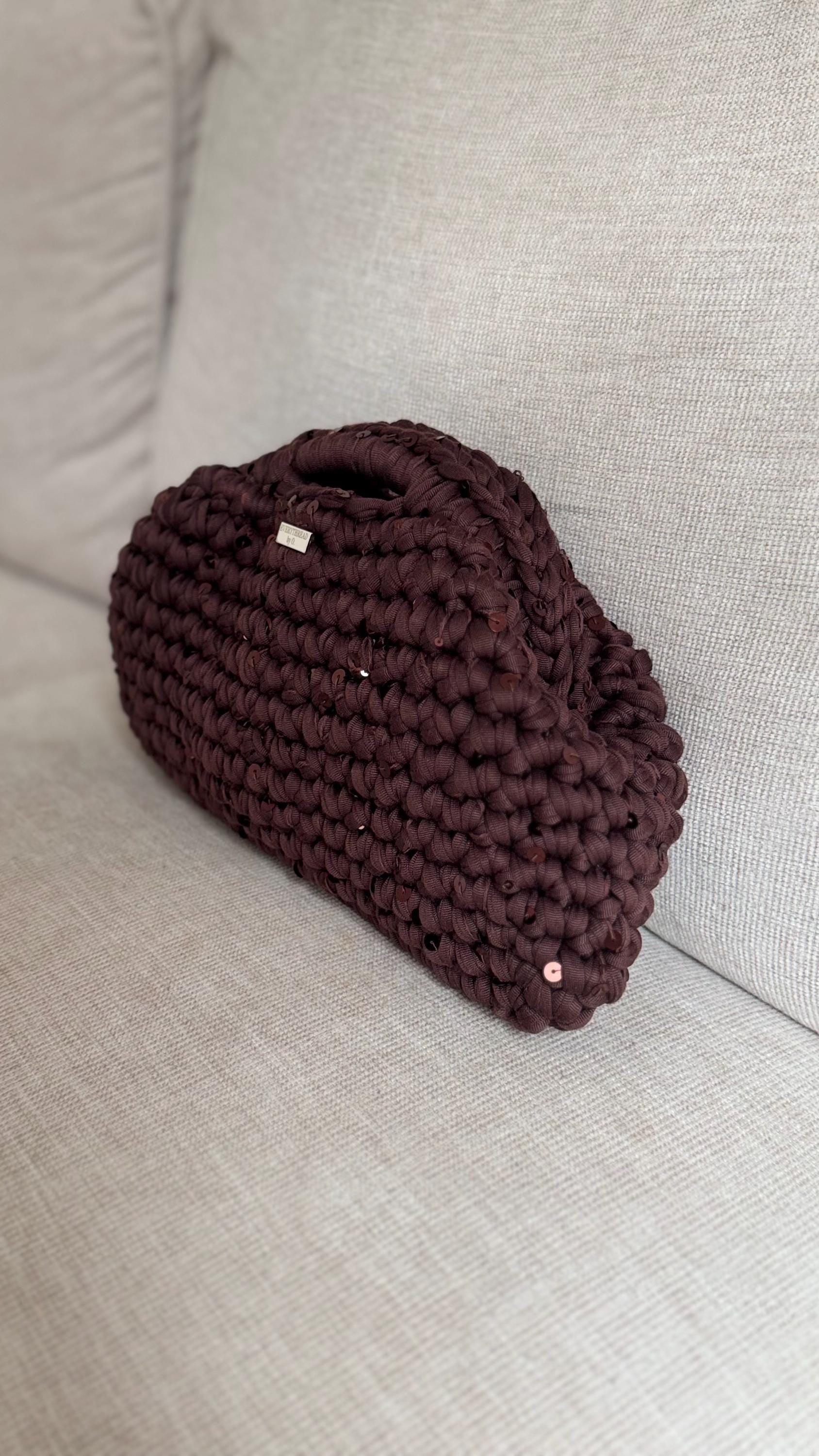 Chocolate brown sequin clutch, close-up of chunky crochet texture