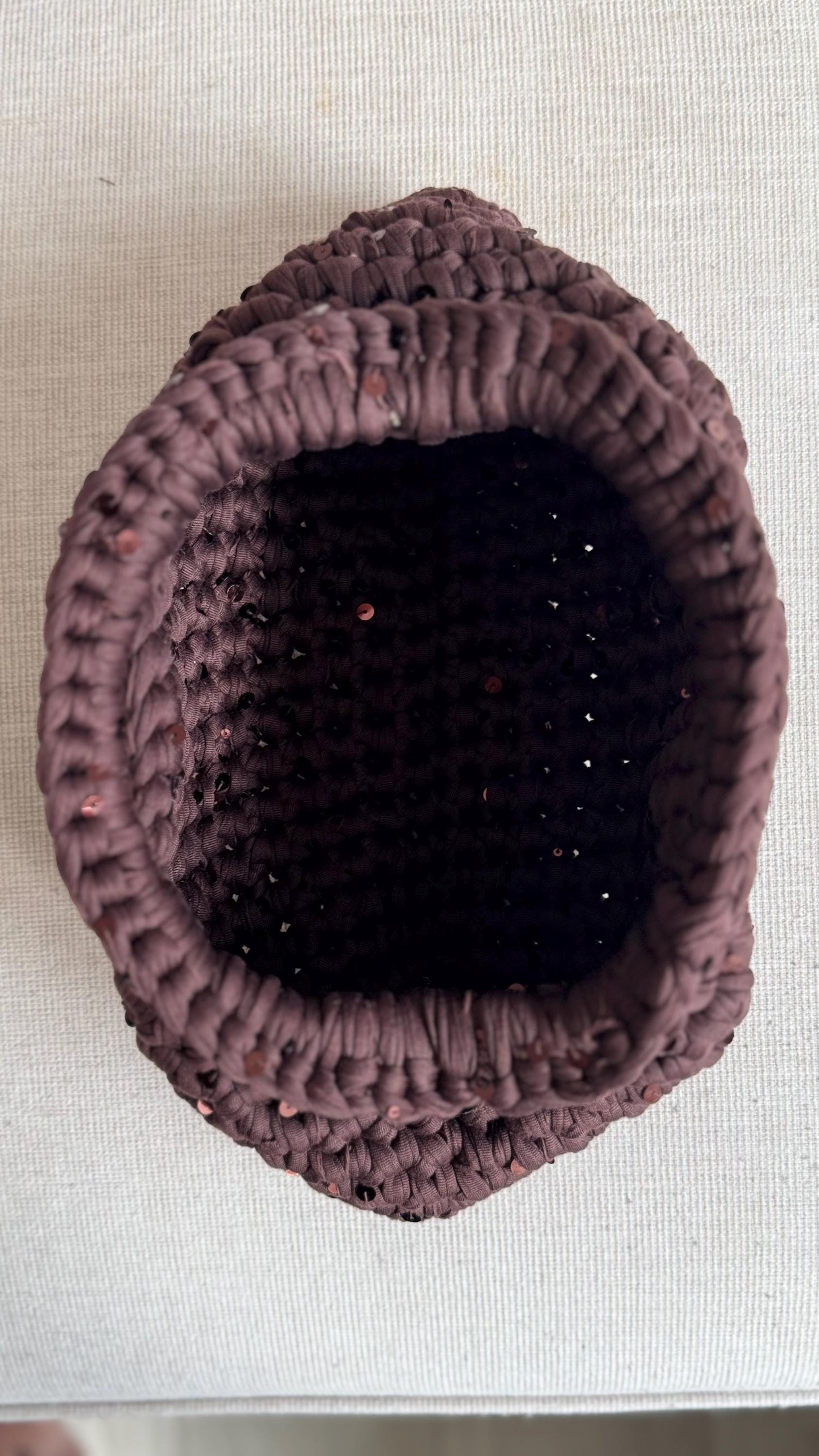 Chocolate brown sequin clutch, handle detail