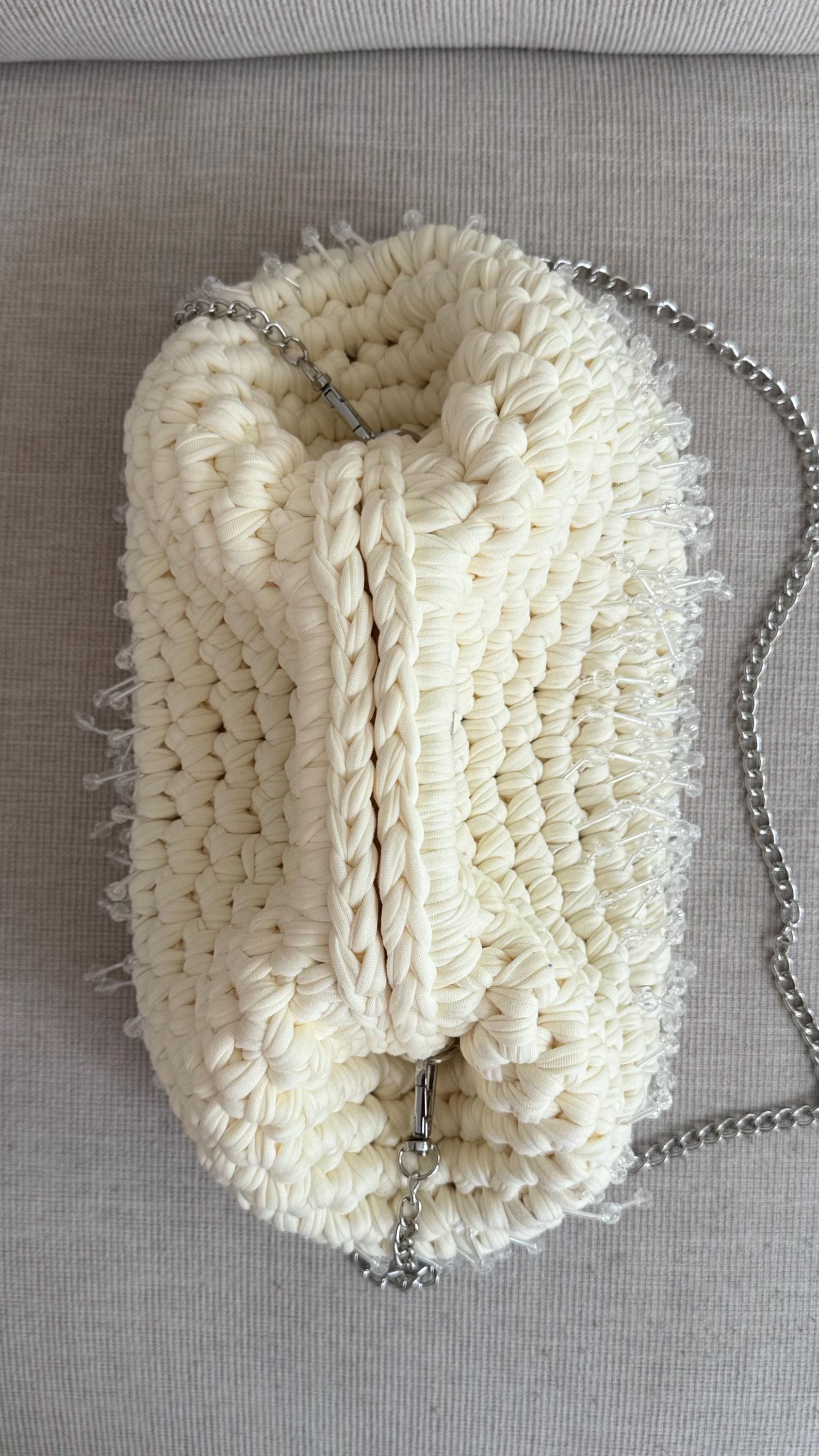 Cream Beaded Tassel Clutch, close-up of beaded tassel detail