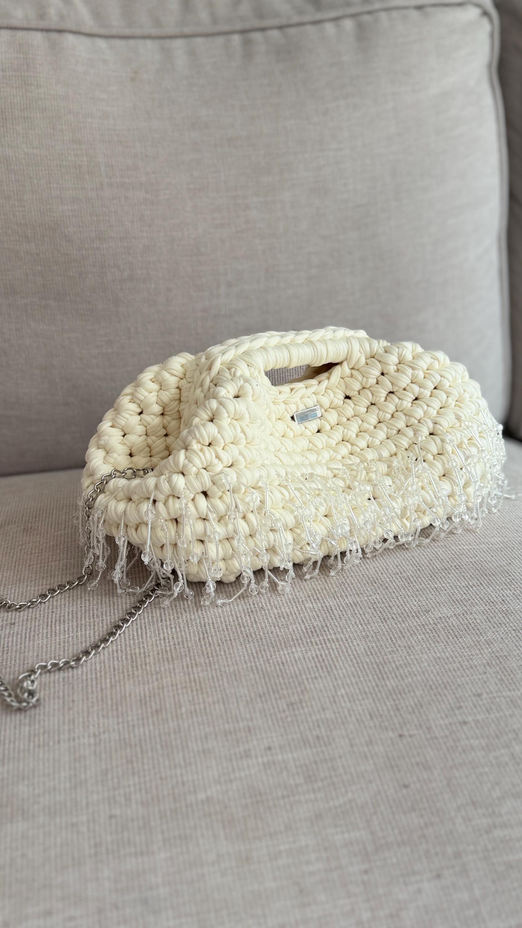 Cream Beaded Tassel Clutch, styled view