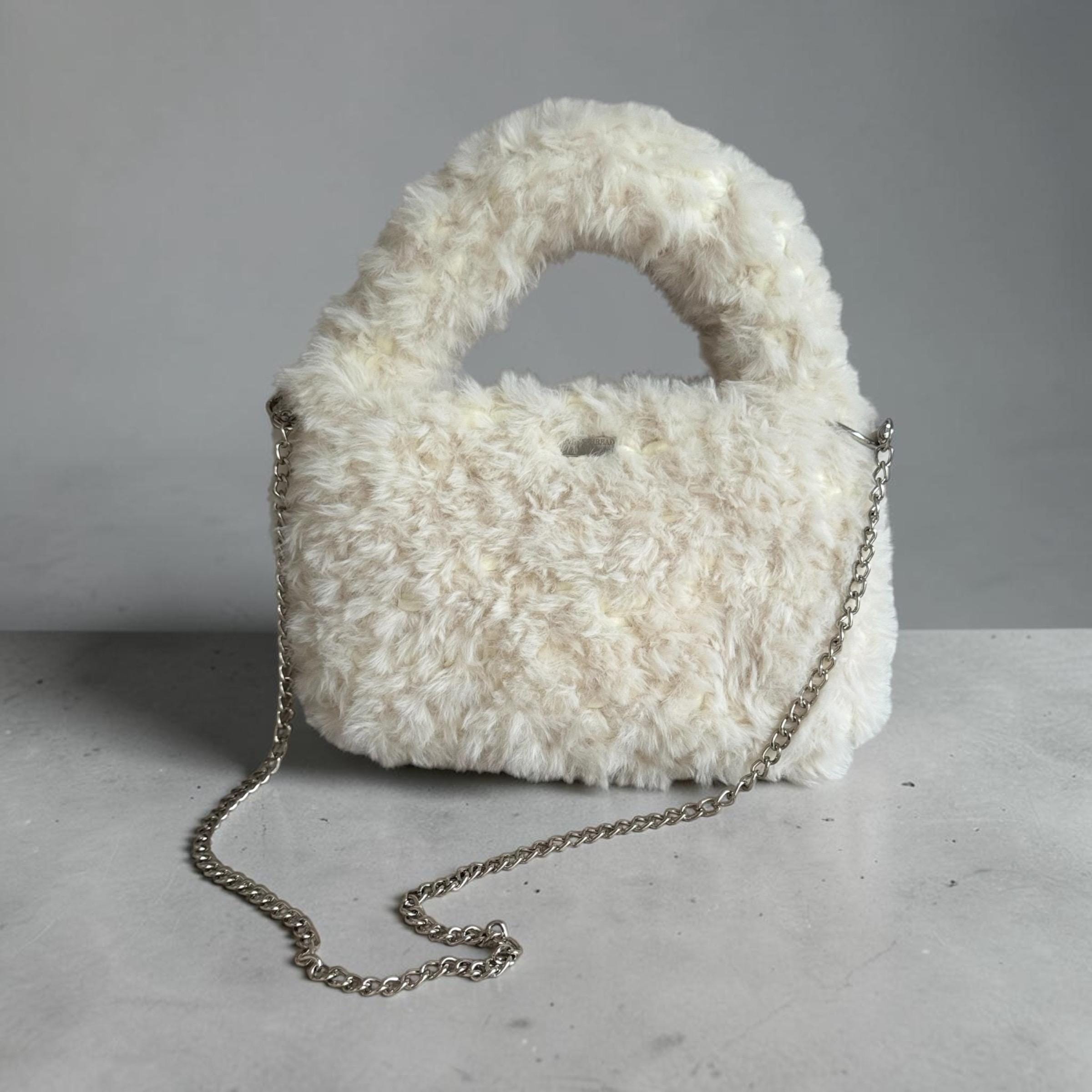 Handmade plush faux-fur shoulder bag in cream with a silver-tone chain strap