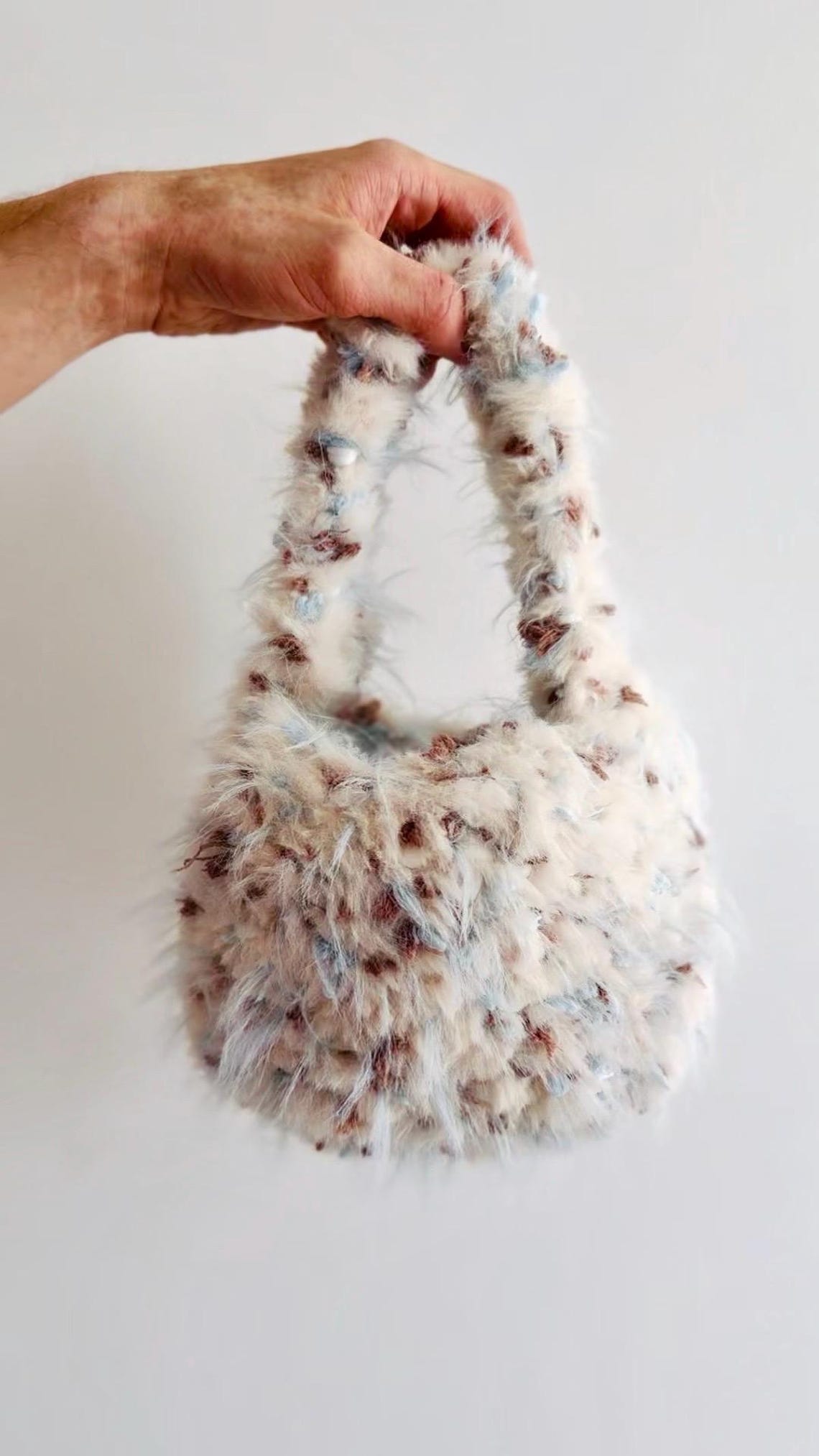 Fluffy cream crochet handbag with blue and brown flecks
