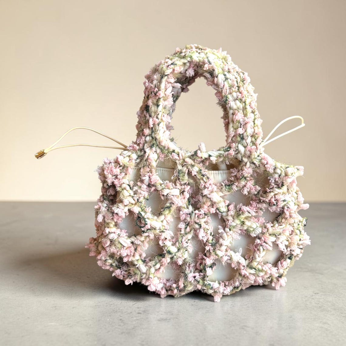 Pink, green and white floral crochet net bag with removable pouch