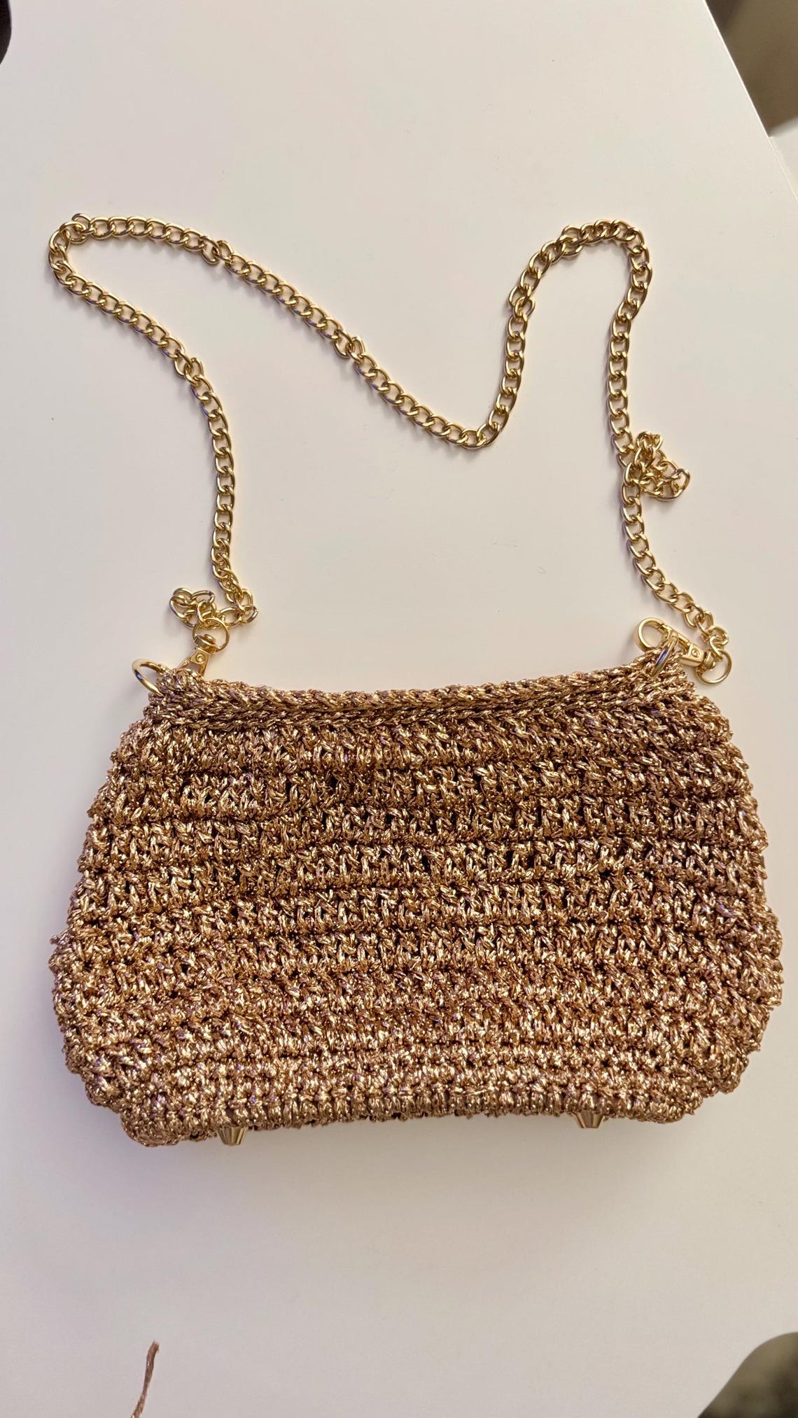 Gold crochet evening bag with a golden chain strap