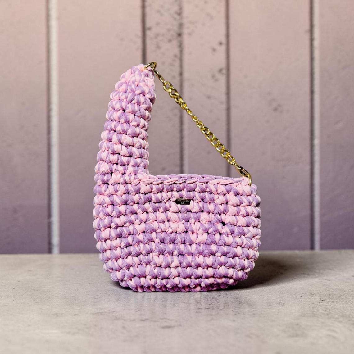 Lilac and blush pink crochet shoulder bag with a geometric handle