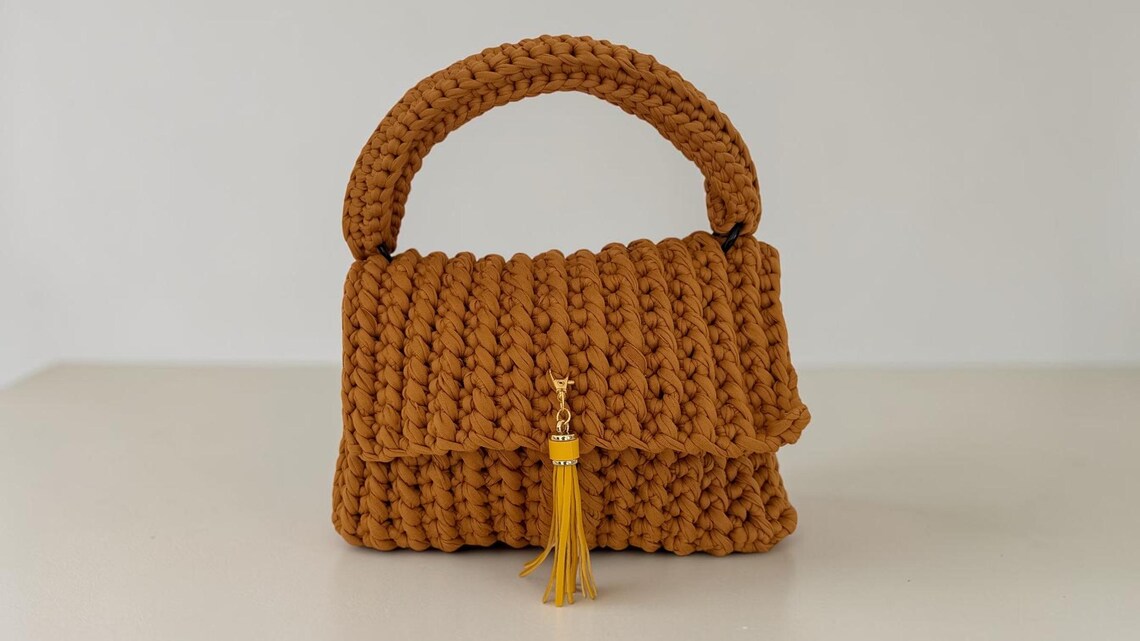 Mustard crochet flap handbag with yellow tassel keychain