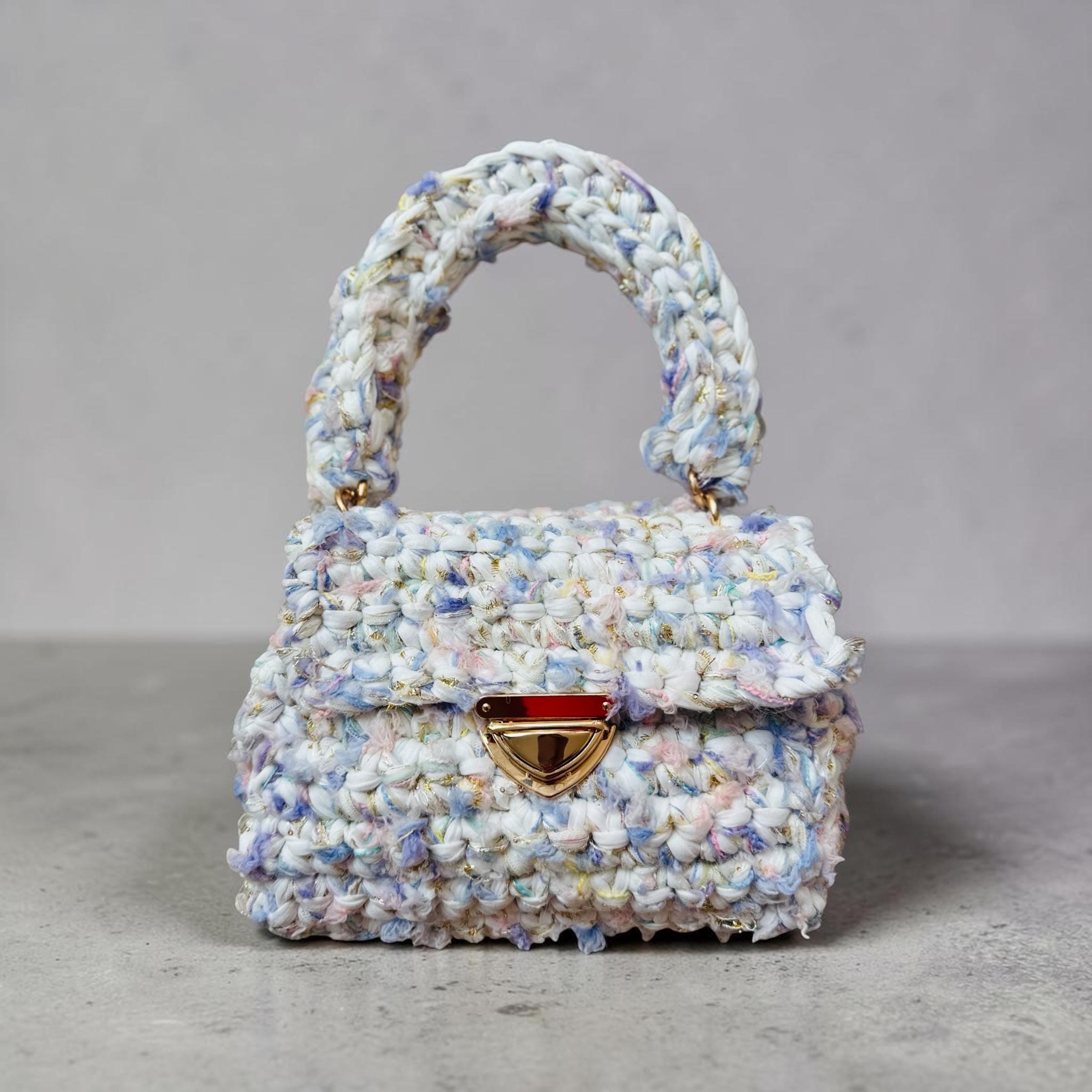 Handmade pastel crochet handbag in white, blue, lavender and pink with a gold-tone clasp