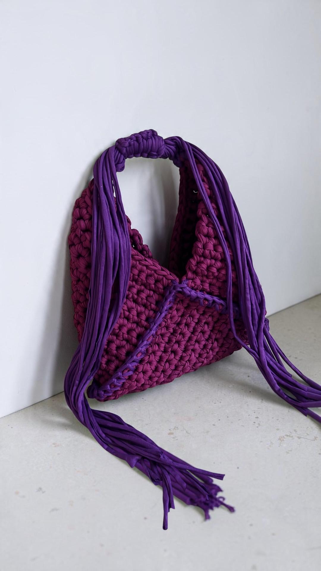 Plum purple chunky crochet bag with long violet fringe and adjustable strap