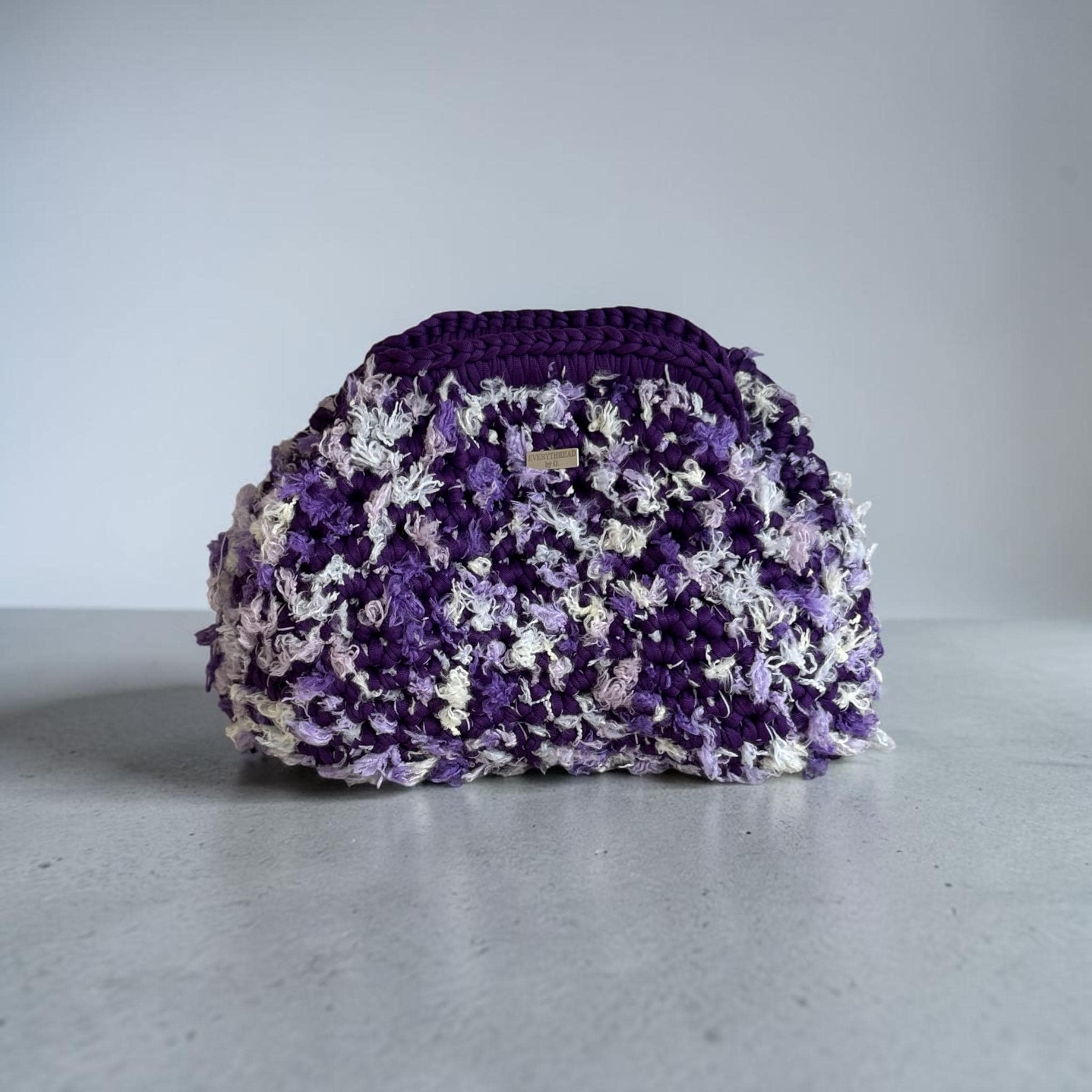 Handmade purple and lavender floral crochet clutch with a fermoir clasp closure