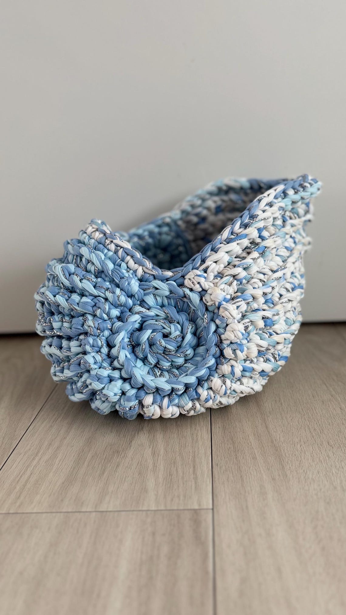 Handmade blue and white crochet seashell-shaped storage basket